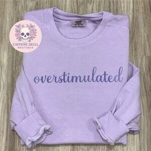 Comfort Colors Lavender Sweatshirt with “overstimulated” in darker purple